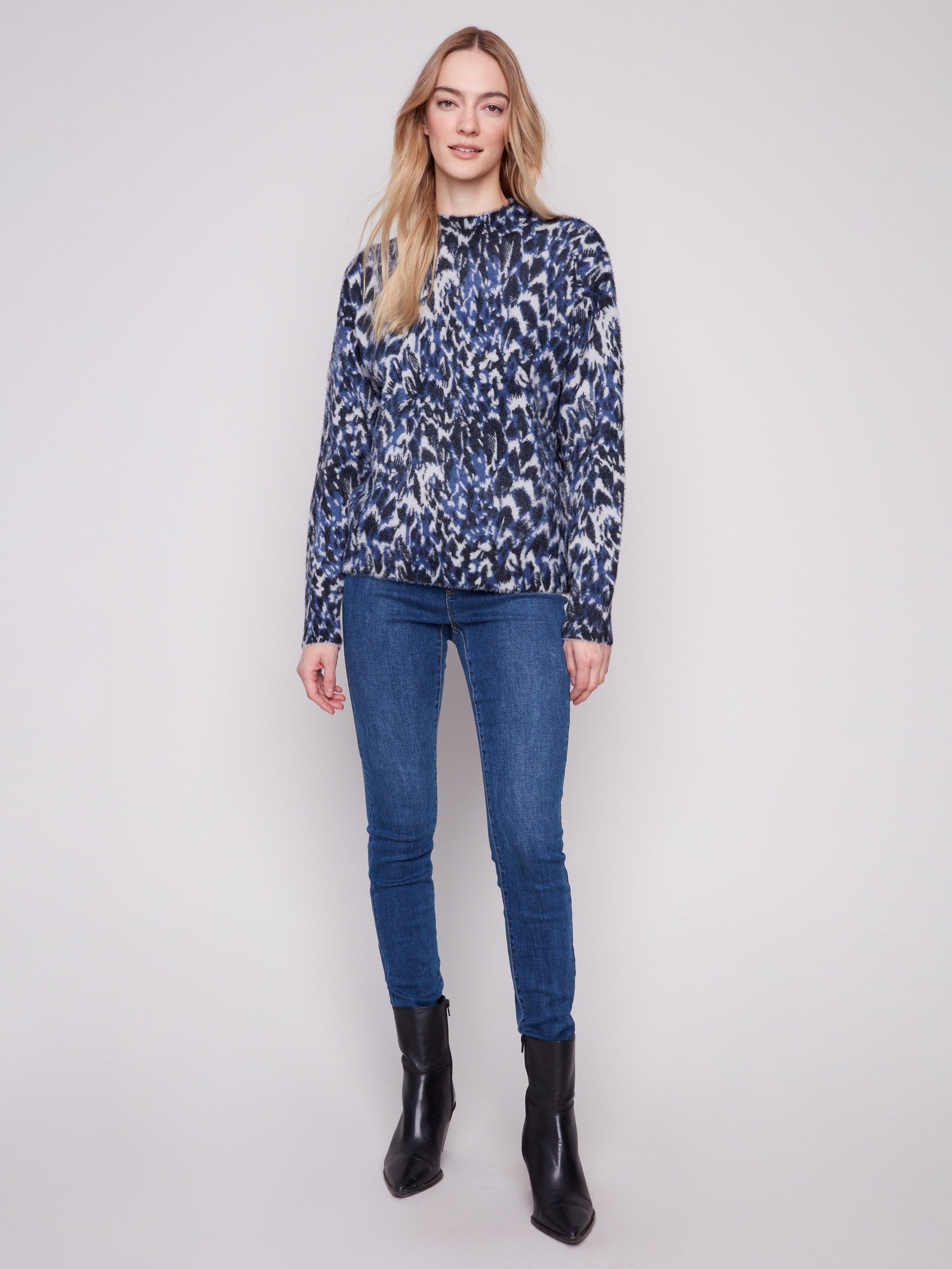 Relaxed fit sweater with a chic abstract panther design, offering comfort and style by Charlie B.