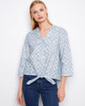 Blue eyelet cotton blouse featuring a Henley neckline and intricate embroidered pattern, perfect for casual elegance by Charlie B.