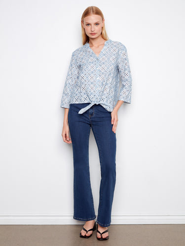 Stylish blue blouse with 3/4 roll-up sleeves and eye-catching embroidery, crafted from 100% cotton for comfort by Charlie B.