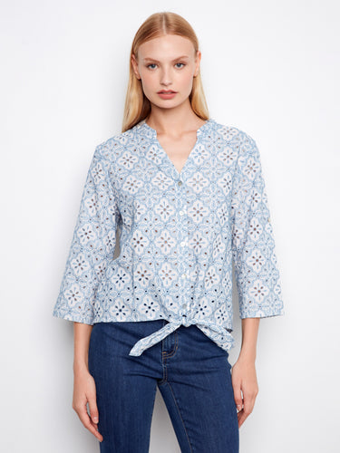 Embroidered blue blouse with button front and charming front tie detail, adding a playful touch to your outfit by Charlie B.