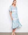Elegant faux wrap dress with a flattering V-neck and flutter sleeves, perfect for any occasion by Charlie B.
