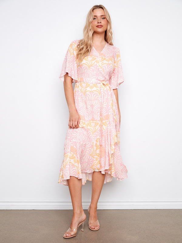 Elegant dress featuring a V-neckline and self-tie belt, perfect for any occasion. Designed by Charlie B.