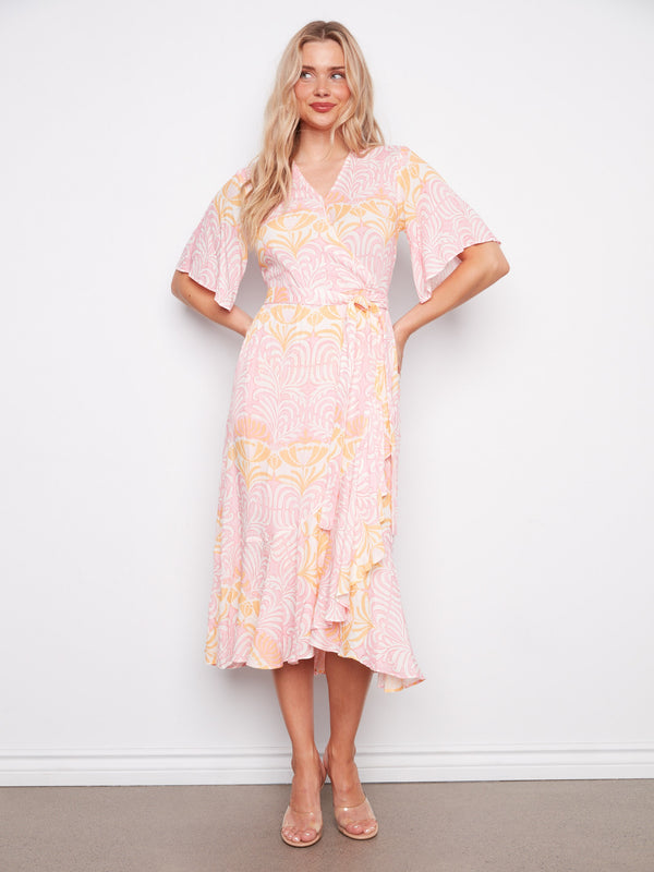 Chic faux wrap design with elbow sleeves adds a touch of sophistication to this maxi length dress. By Charlie B.