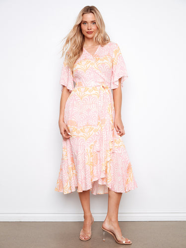 Elbow sleeves complement the faux wrap design of this stunning maxi dress, ideal for day or night wear. By Charlie B.