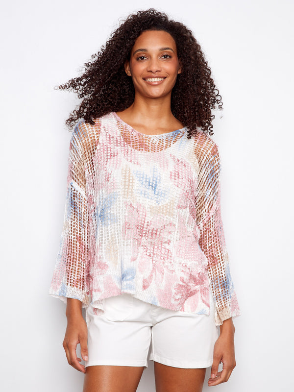 Floral mesh top with a flattering V-neck design, perfect for any casual outing. The loose fit ensures comfort throughout the day by Charlie B.