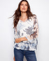 V-neck fishnet crochet sweater with loose fit and abstract print, perfect for casual outings by Charlie B.