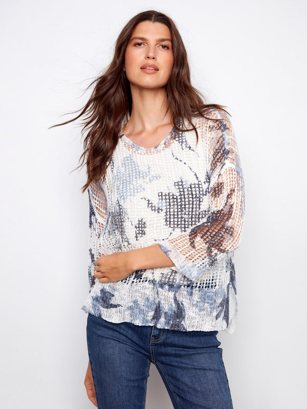 V-neck fishnet crochet sweater with loose fit and abstract print, perfect for casual outings by Charlie B.