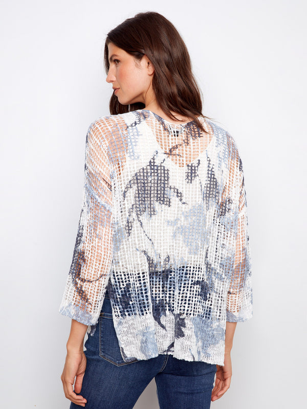 3/4 sleeve fishnet crochet sweater with abstract print, ideal for a relaxed yet trendy style by Charlie B.