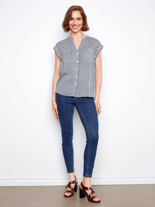 Chic navy gingham blouse with cap sleeves and a classic button-up front for a relaxed look by Charlie B.