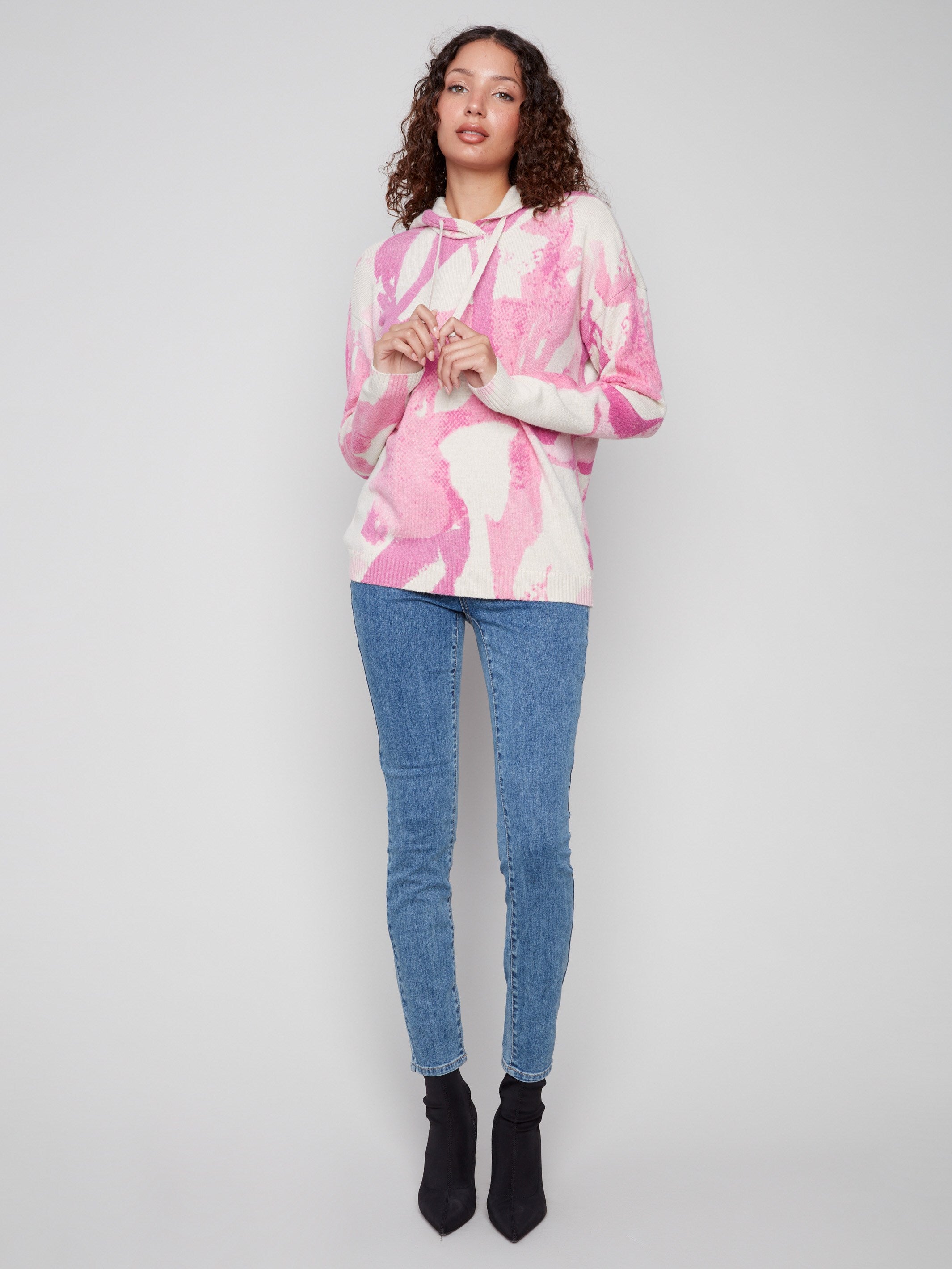 Cozy pink abstract printed hoodie sweater with drop shoulders for a relaxed fit by Charlie B.