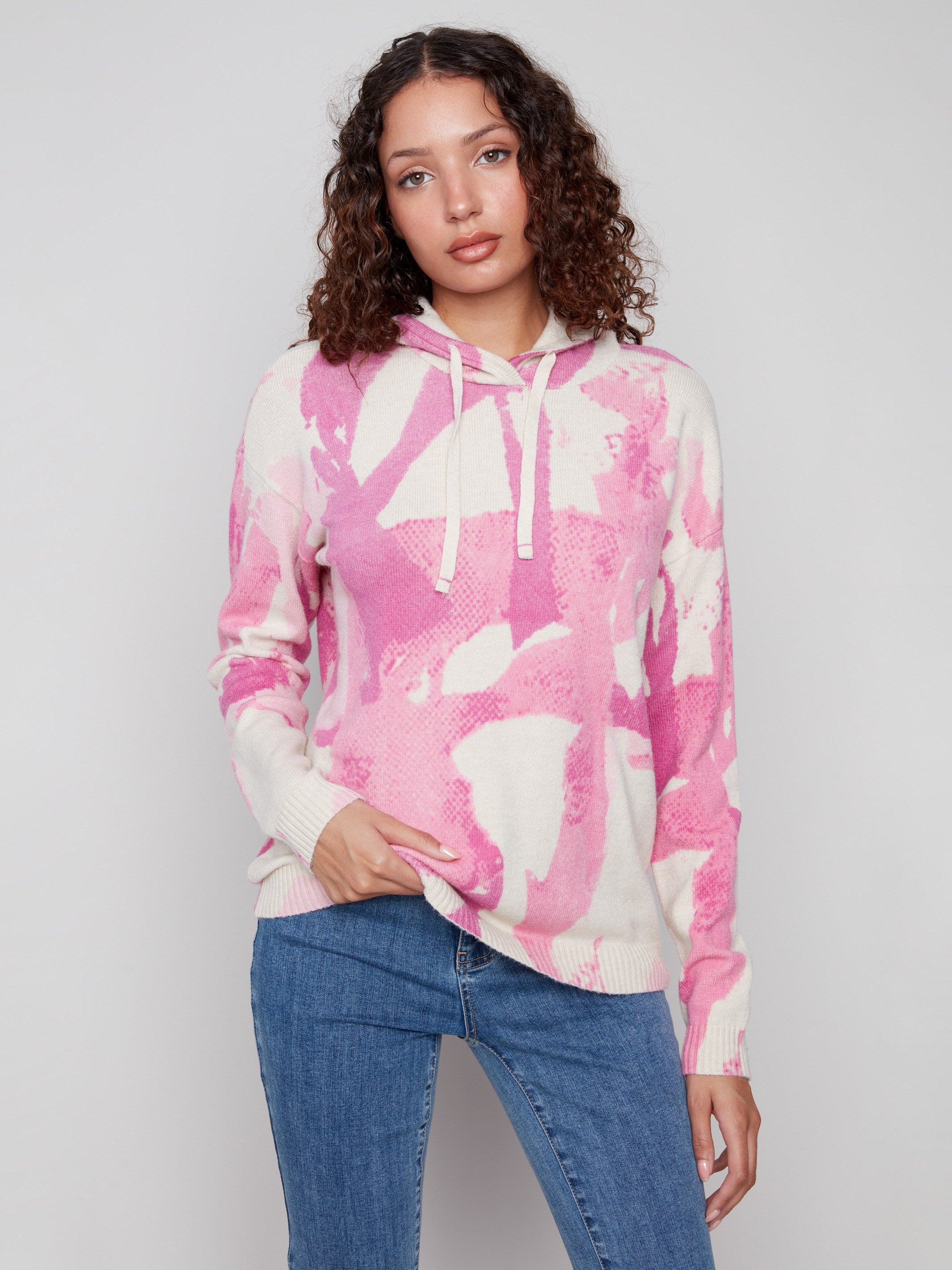 Stylish pink abstract printed hoodie sweater with knit cuffs for added comfort by Charlie B.