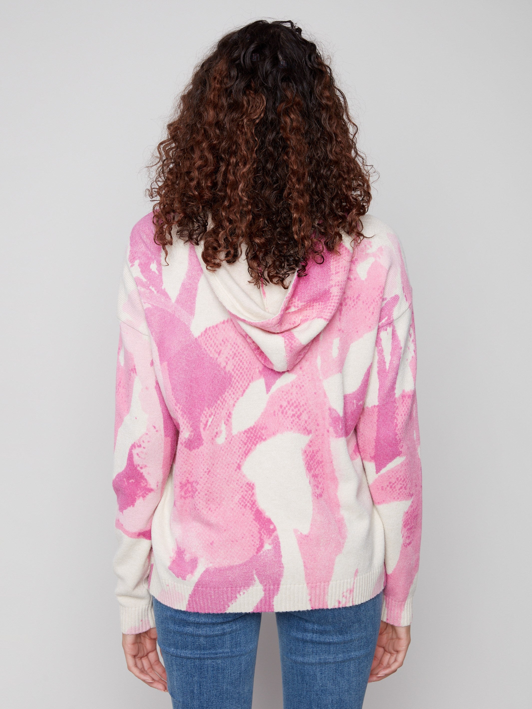 Vibrant pink abstract print on this hoodie sweater, complete with an adjustable hood by Charlie B.