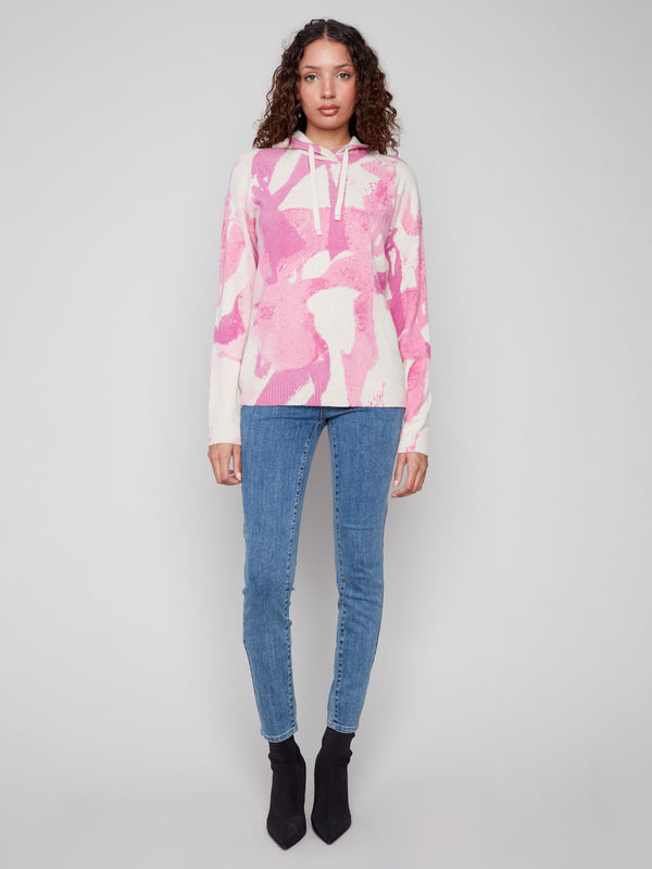 Chic pink abstract printed hoodie sweater showcasing drop shoulders for easy wear by Charlie B.