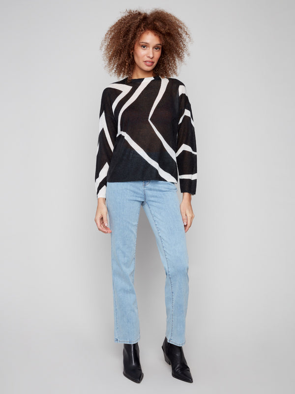 Black/Ecru mohair-like sweater with drop shoulders, featuring a chic geometric design by Charlie B.