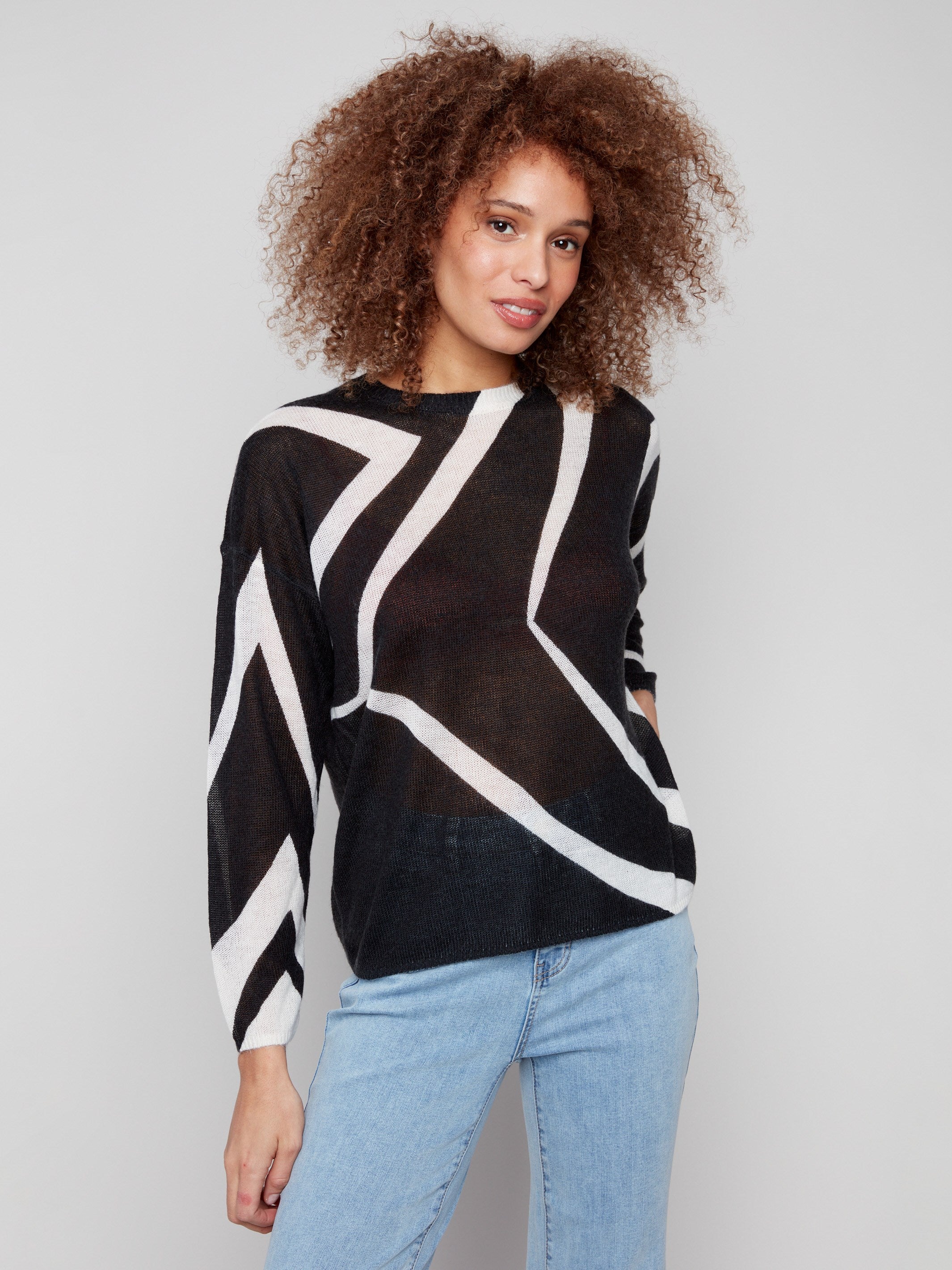 Elegant Black/Ecru sweater showcasing a semi-sheer knit and modern crew neckline by Charlie B.