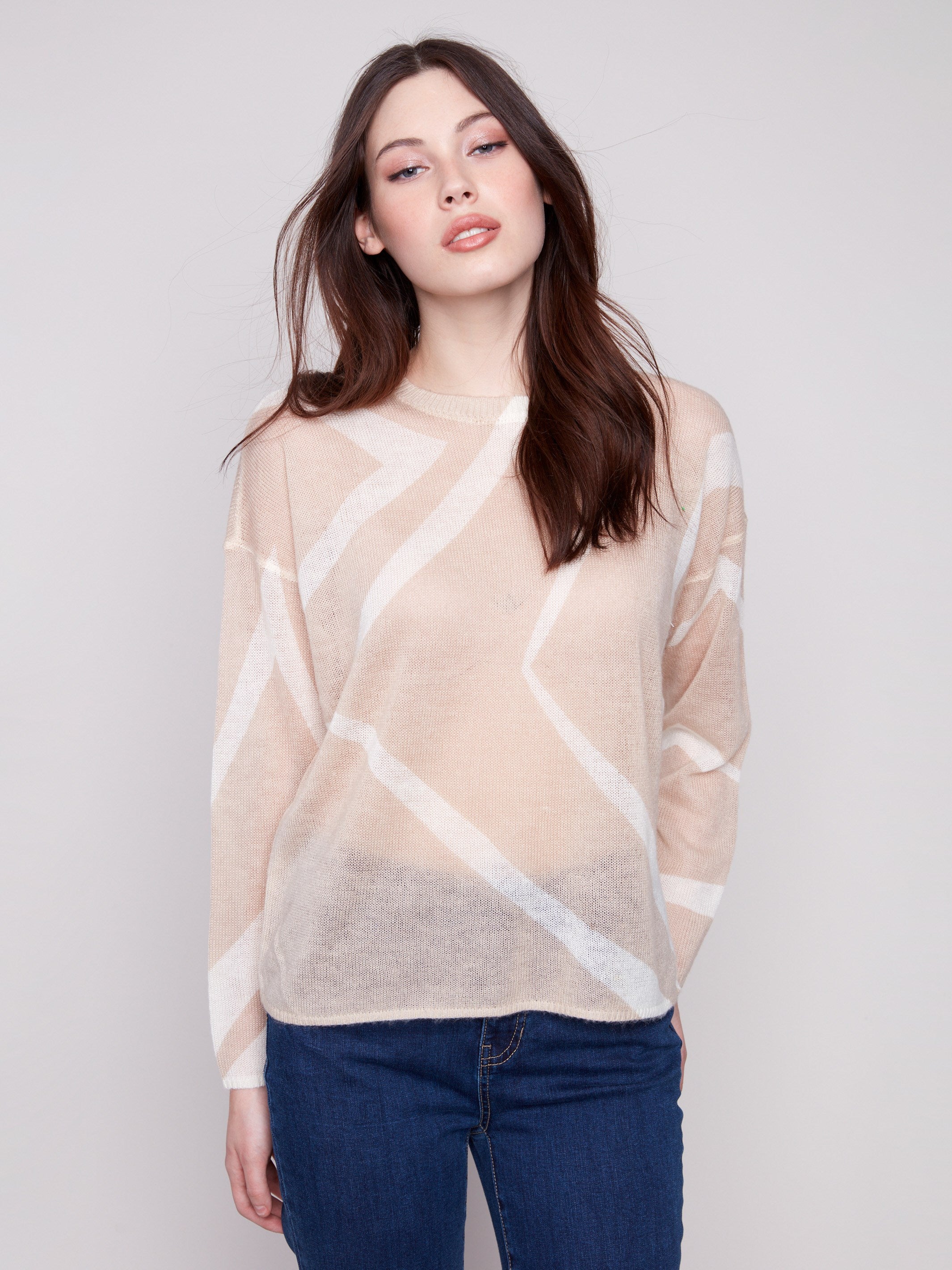Stylish lightweight sweater in Sesame/Ecru displaying a semi-sheer knit and contemporary geometric design by Charlie B.