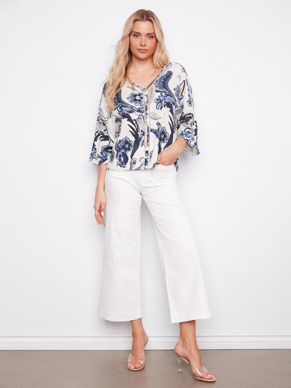 Embrace style with this Ibiza-inspired print blouse, complete with wide 3/4 sleeves by Charlie B.