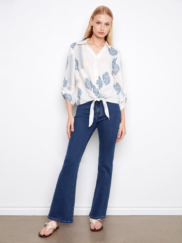 Chic blouse featuring roll-up sleeves and a beautiful print, perfect for casual or dressed-up looks. By Charlie B.