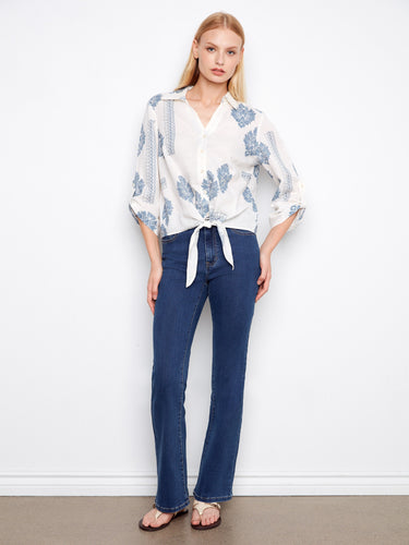 Versatile blouse combining classic elements with modern flair, ideal for any wardrobe update. By Charlie B.