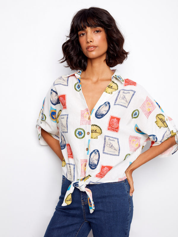 Postcard print blouse showcasing a button-up style and front tie detail by Charlie B.