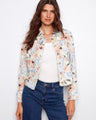 This floral jacket features a short length, perfect for a chic and modern look. It's ideal for pairing with jeans or skirts by Charlie B.