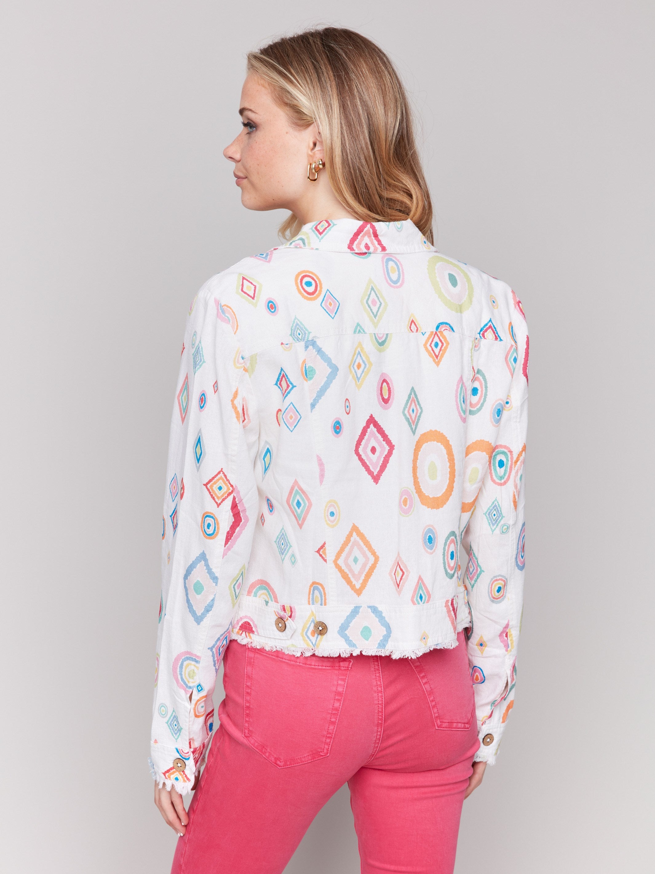 White jacket with front pockets and colorful diamonds by Charlie B.