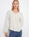 Blouse featuring a stylish notch neckline, perfect for casual outings. The fabric's delicate pattern adds elegance by Charlie B.