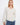 Blouse featuring a stylish notch neckline, perfect for casual outings. The fabric's delicate pattern adds elegance by Charlie B.
