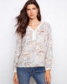 Paisley print blouse with crochet trim, featuring a notch neckline for added style by Charlie B.