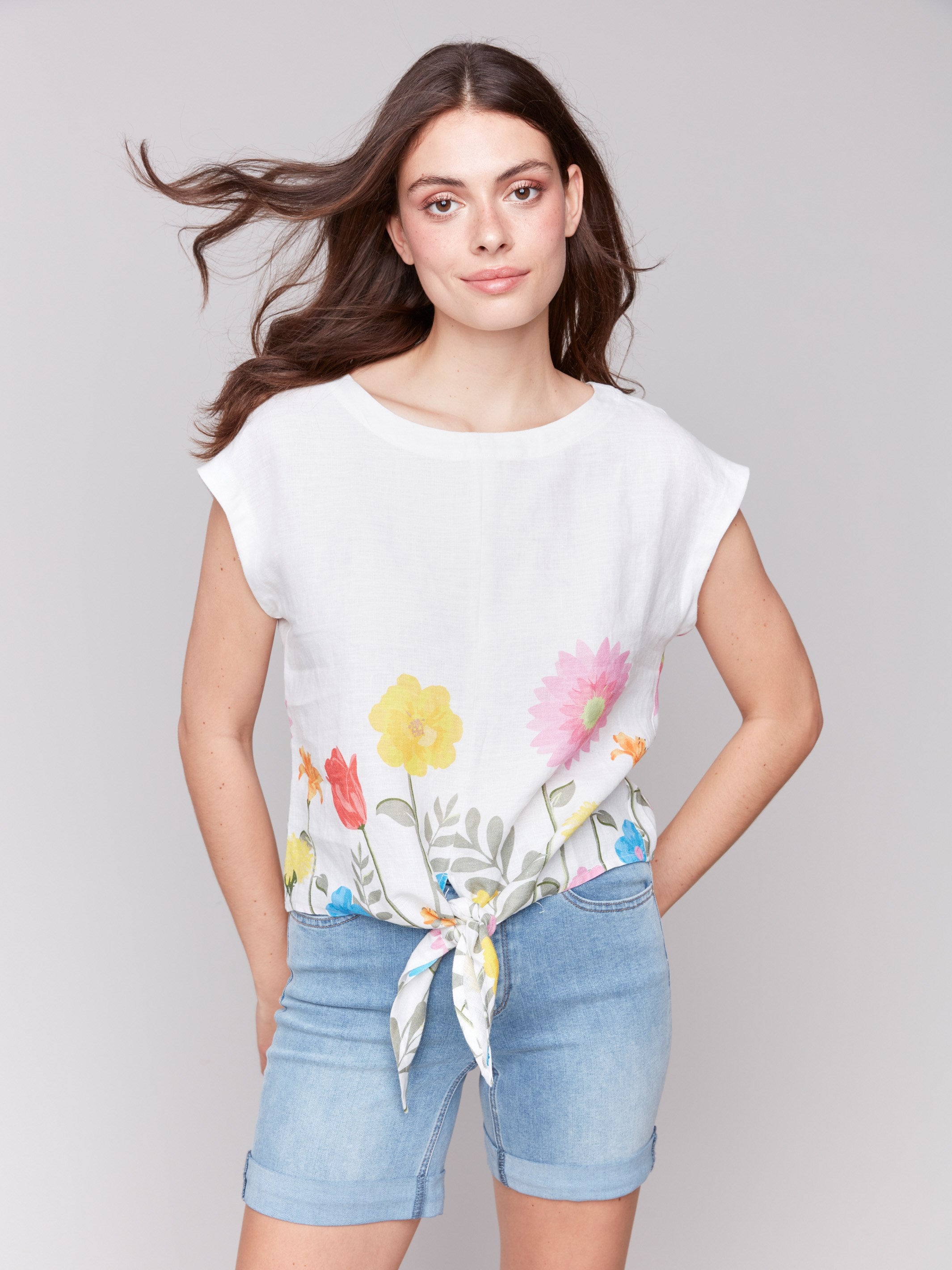 Blouse with a crew neckline and vibrant floral accents by Charlie B.