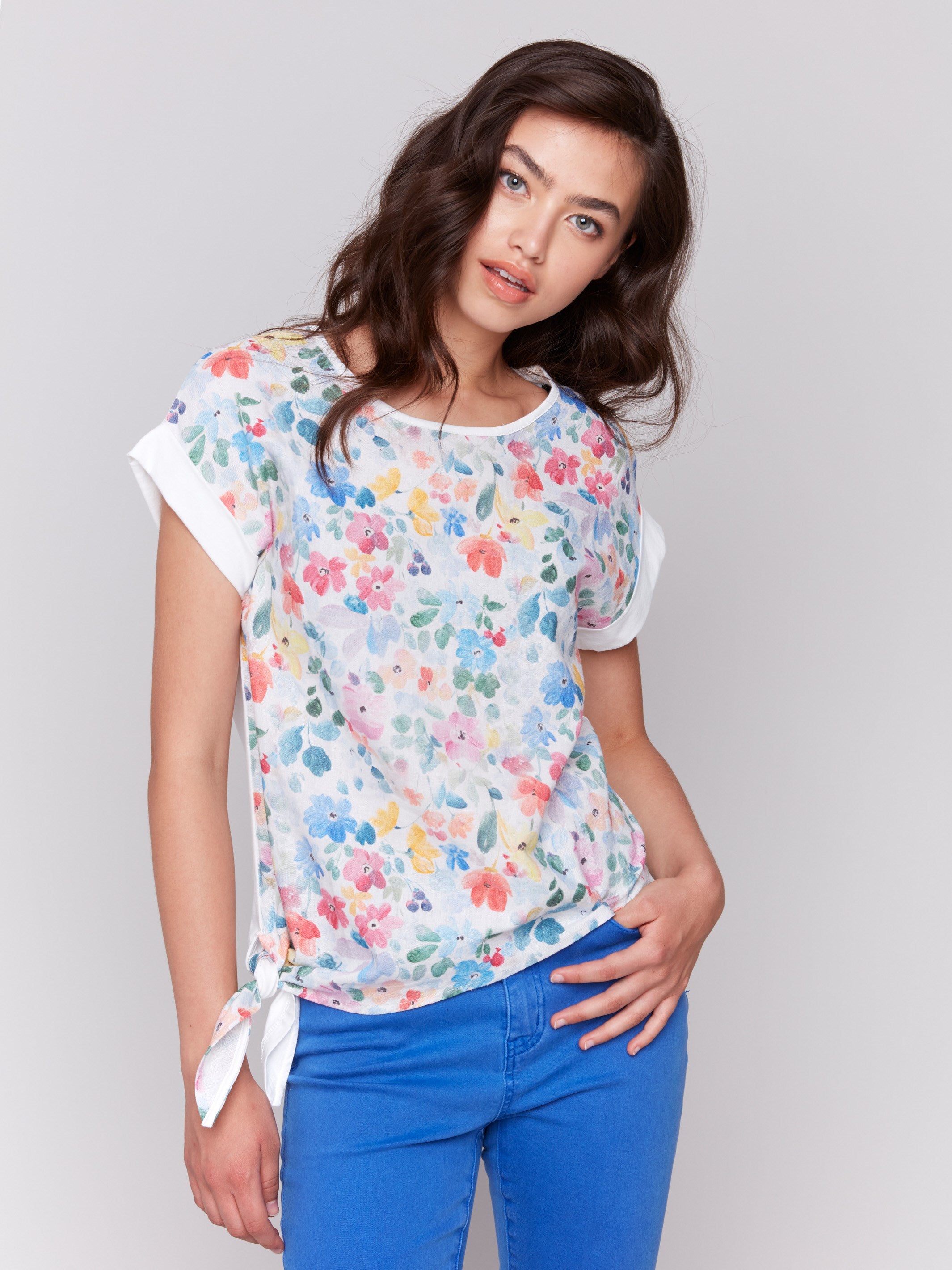 White floral top with crew neckline and side tie detail by Charlie B.