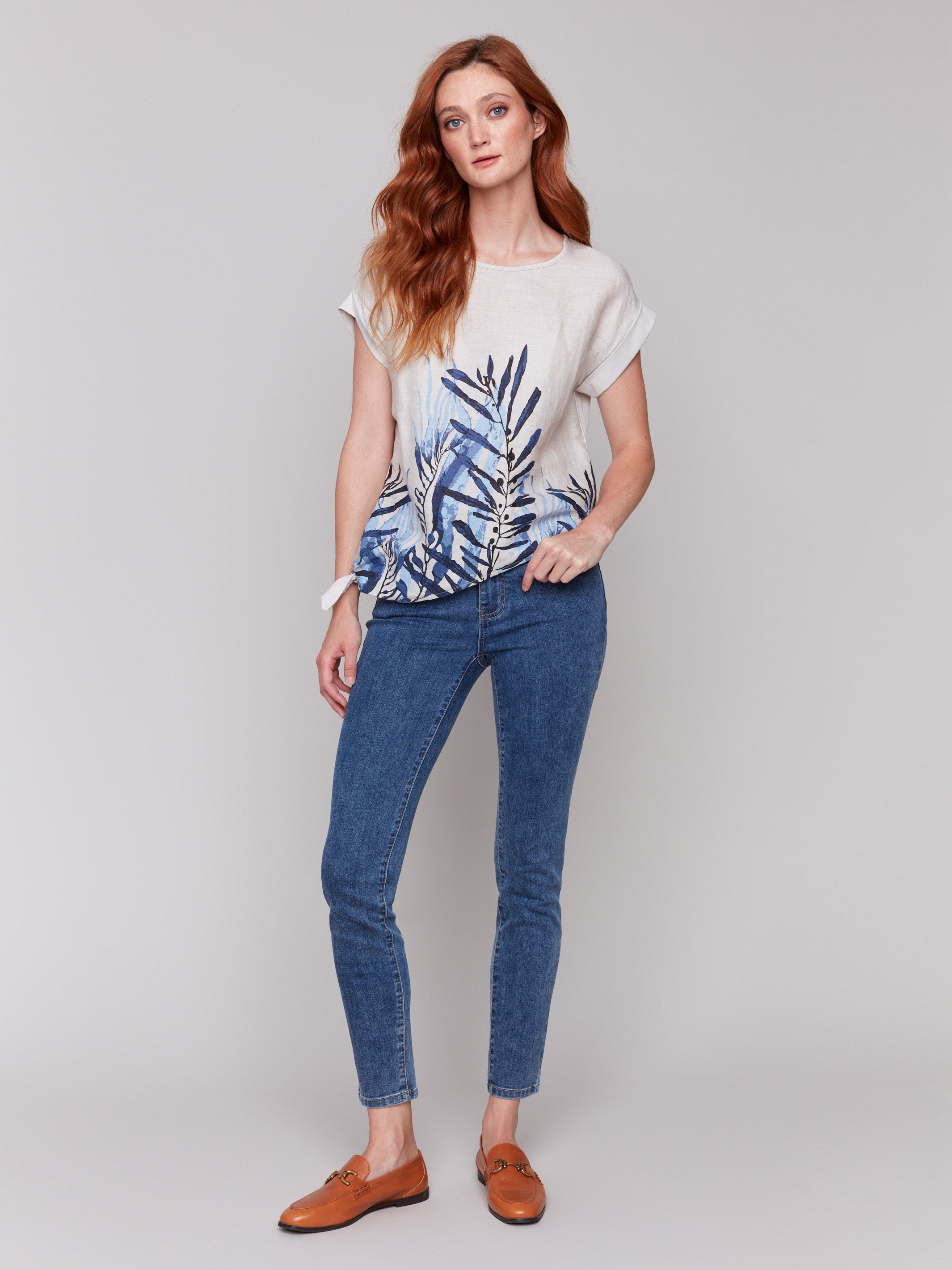 Chic palm print enhances this versatile, lightweight blouse by Charlie B.