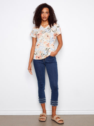 Chic and comfortable, this relaxed fit shirt features a delightful floral design by Charlie B.