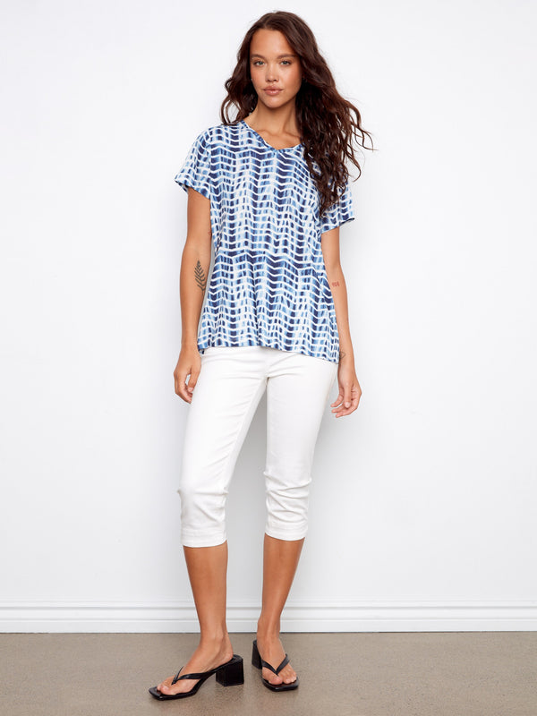This top features a relaxed fit in a chic blue and white pattern, ideal for comfort and style by Charlie B.