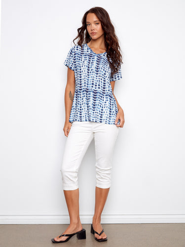 The blue and white design adds flair to this V-neck top, combining comfort with contemporary fashion by Charlie B.