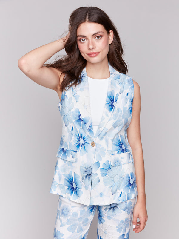 Elegant vest featuring two practical flap pockets and floral design by Charlie B.