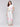 White pants with a wide leg design and smocked waistband, perfect for summer by Charlie B.