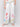 Elegant pull-on style white pants with a colorful floral border by Charlie B.