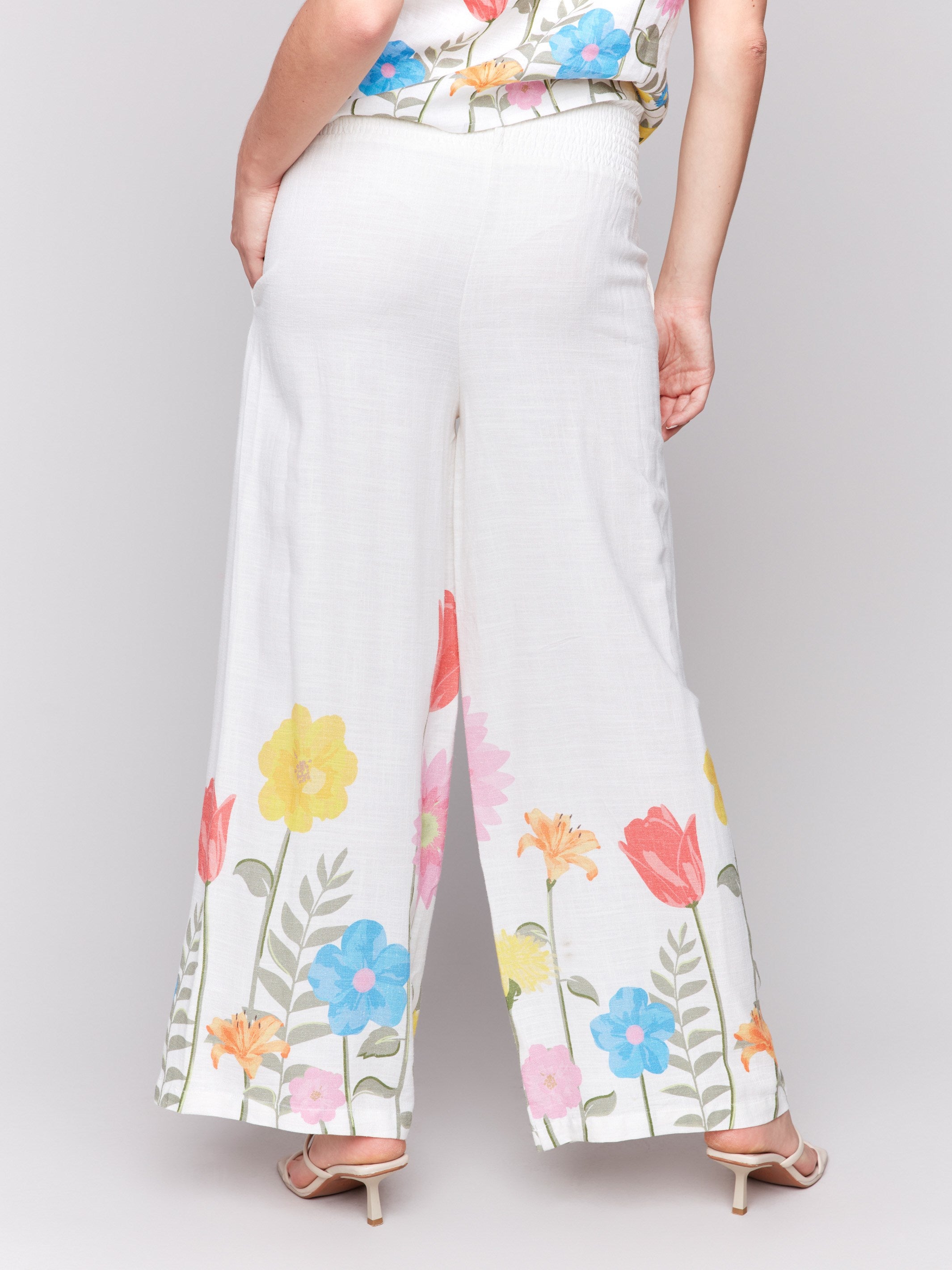 Fashionable wide-leg pants with regular rise, adorned with a floral print by Charlie B.