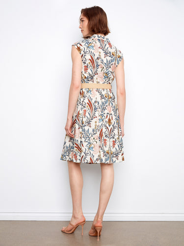 The tailored neckline adds sophistication to this knee-length floral dress, complete with two pockets. By Charlie B.