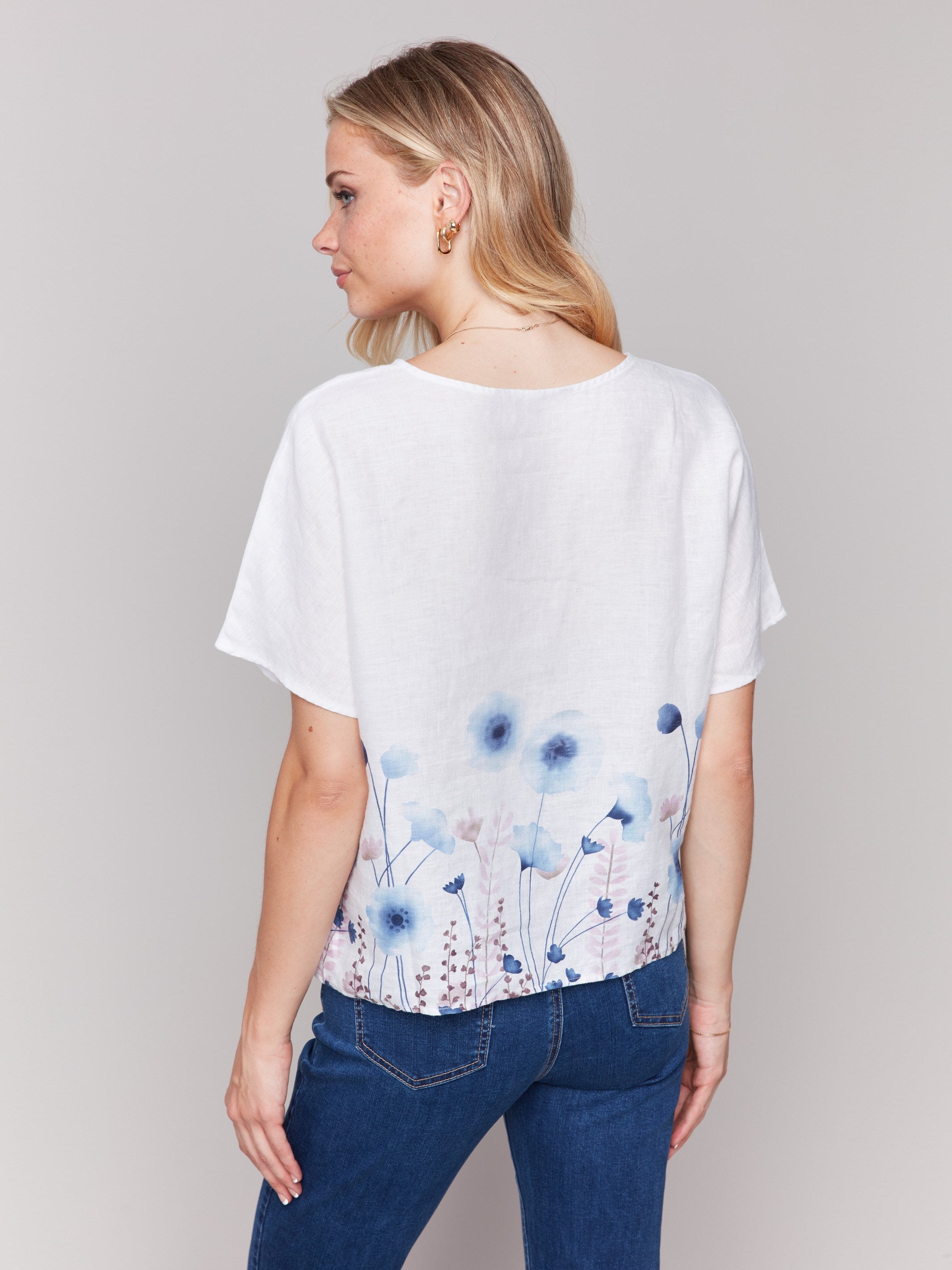 White linen top with a unique design and crew neckline by Charlie B.