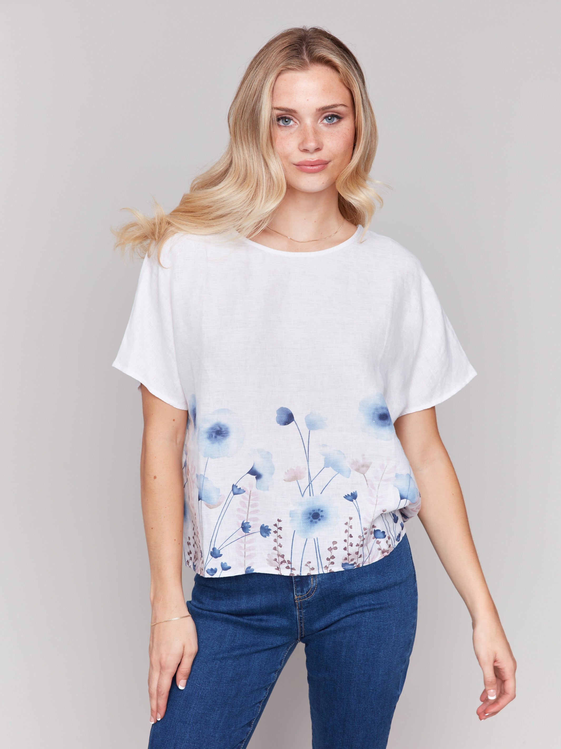 100% linen top showcasing a beautiful floral pattern by Charlie B.