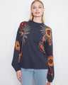 Navy blue sweater with a mock neckline and boho floral design, featuring drop shoulder style and balloon sleeves by Charlie B.
