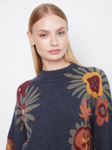 Dark sweater showcasing a floral pattern with long balloon sleeves and mock neckline, designed by Charlie B.