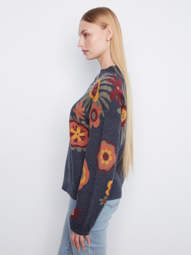 Navy blue top adorned with a vibrant floral print, featuring drop shoulders and a chic mock neck by Charlie B.