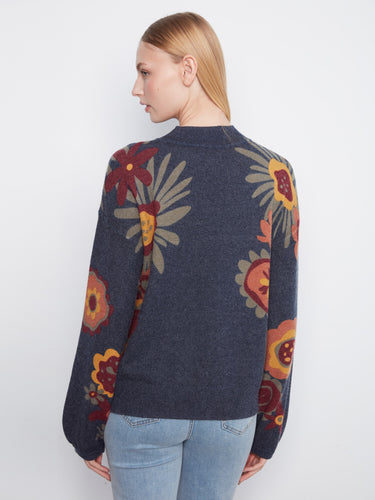 Sweater in dark hue with bohemian floral accents, complete with long balloon sleeves for added flair by Charlie B.