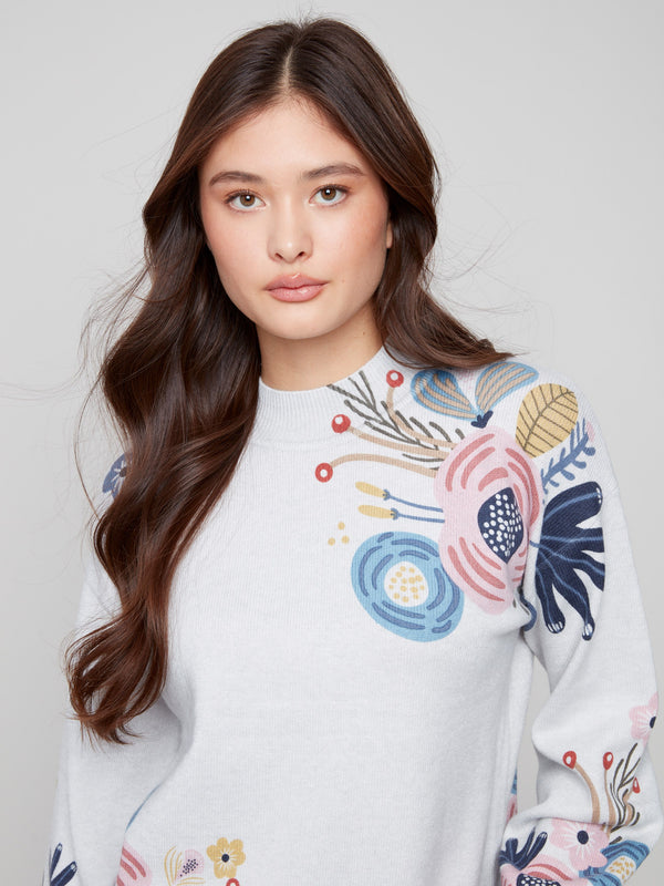 Heather light grey sweater showcasing exquisite floral designs and stylish details by Charlie B.