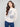 Elegant sweater with a mock neck and floral design, featuring long balloon sleeves by Charlie B.