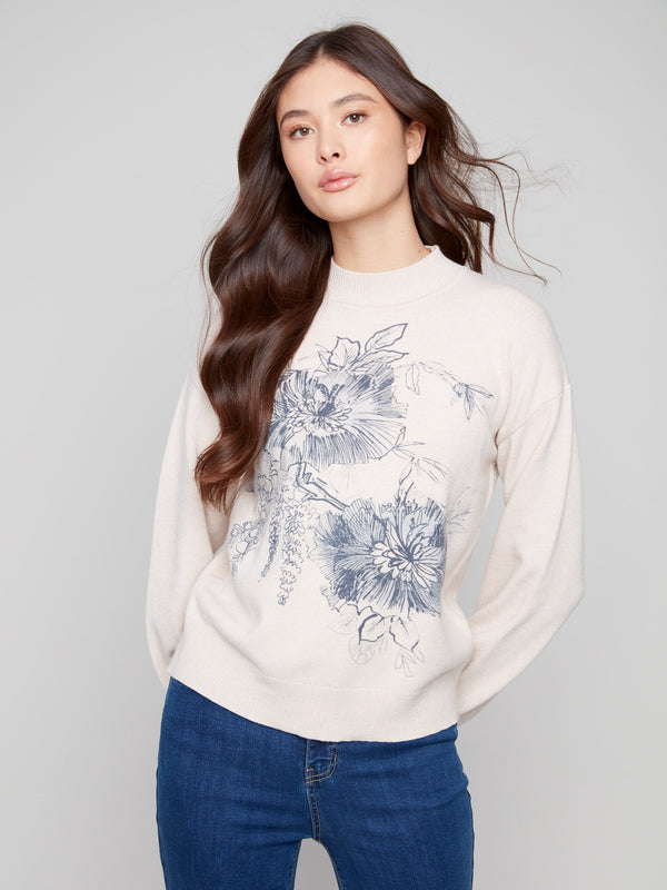 Elegant sweater with a mock neck and floral design, featuring long balloon sleeves by Charlie B.