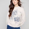 Elegant sweater with a mock neck and floral design, featuring long balloon sleeves by Charlie B.